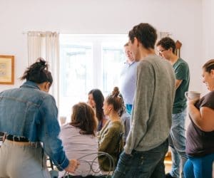 Canva Five People Standing Near Four People Sitting Near Desk 300x250