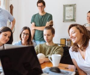 Canva People Looking at Laptop Computer 300x250
