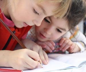 Canva Two Kids Writing on a Notebook 300x250