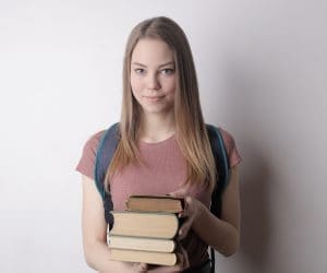 Canva Woman in Red Crew Neck T shirt Holding Books 300x250